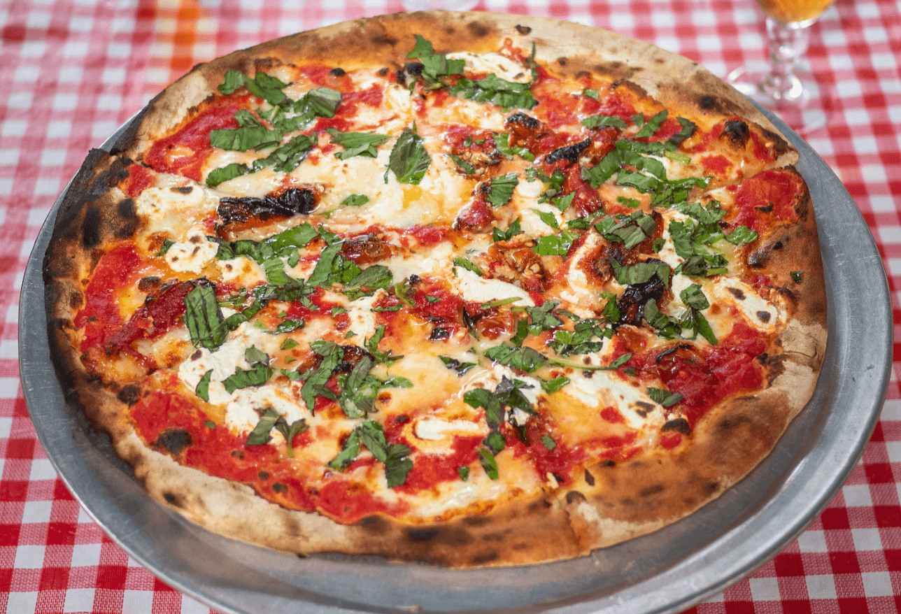A close-up of a fresh slice of pizza on a table