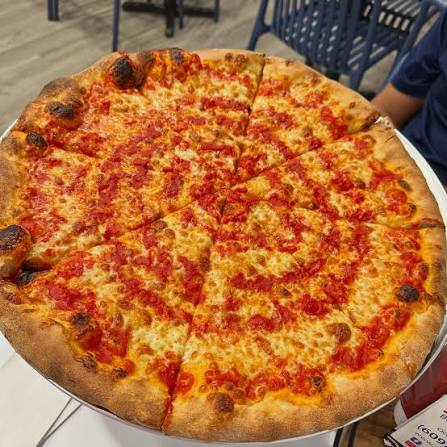 Whole Jersey Shore boardwalk-style cheese pizza with a thin crust and bright tomato sauce