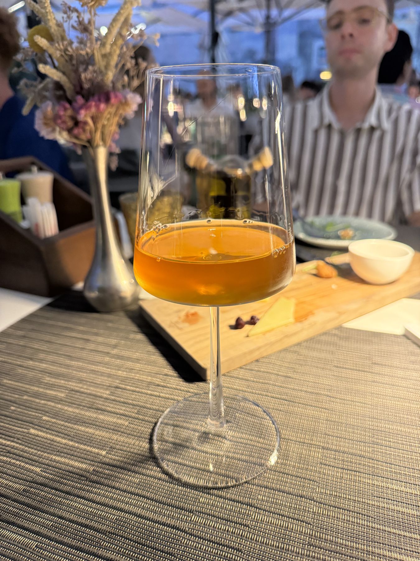 Glass of orange wine at a table in Dubrovnik