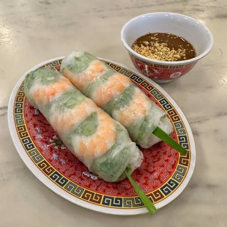 Plate of goi cuon fresh spring rolls with peanut dipping sauce