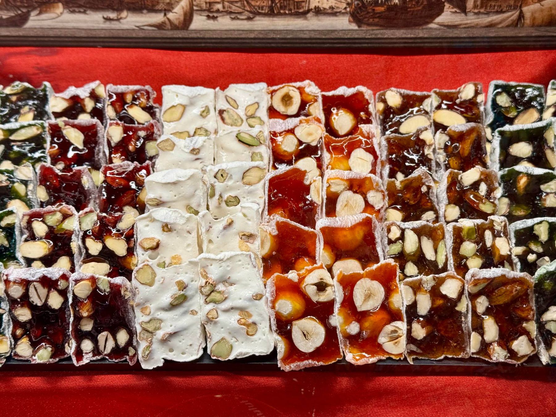 Rows of nut-topped Turkish delight pieces on display