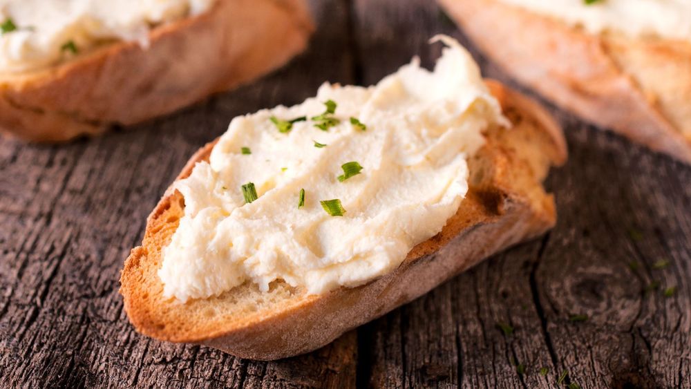 Kajmak spread on slices of toasted bread