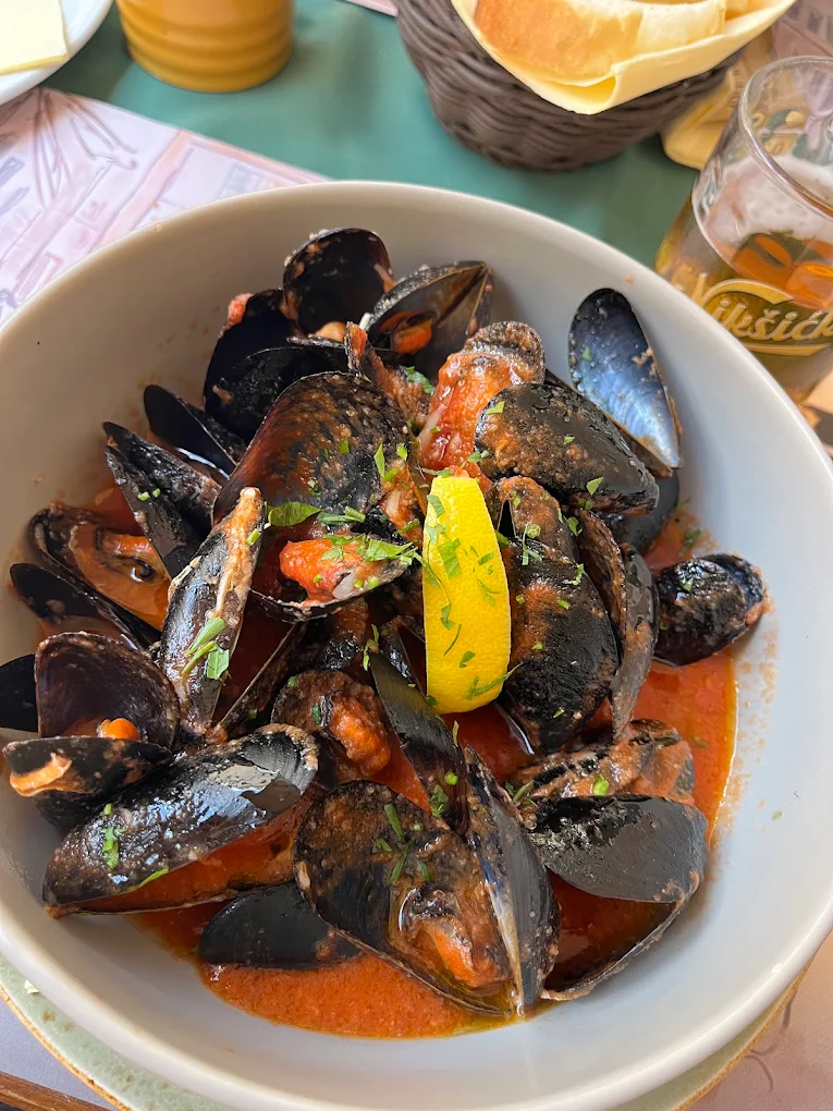 Mussels buzara in tomato broth with lemon in Kotor