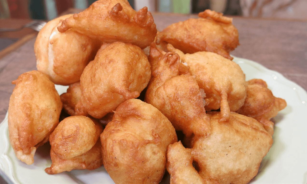 Golden priganice fritters on a plate in Kotor