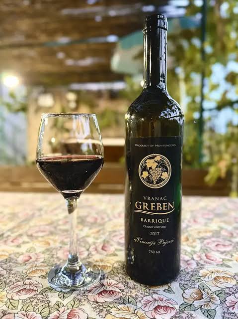 Bottle and glass of Vranac wine in Kotor