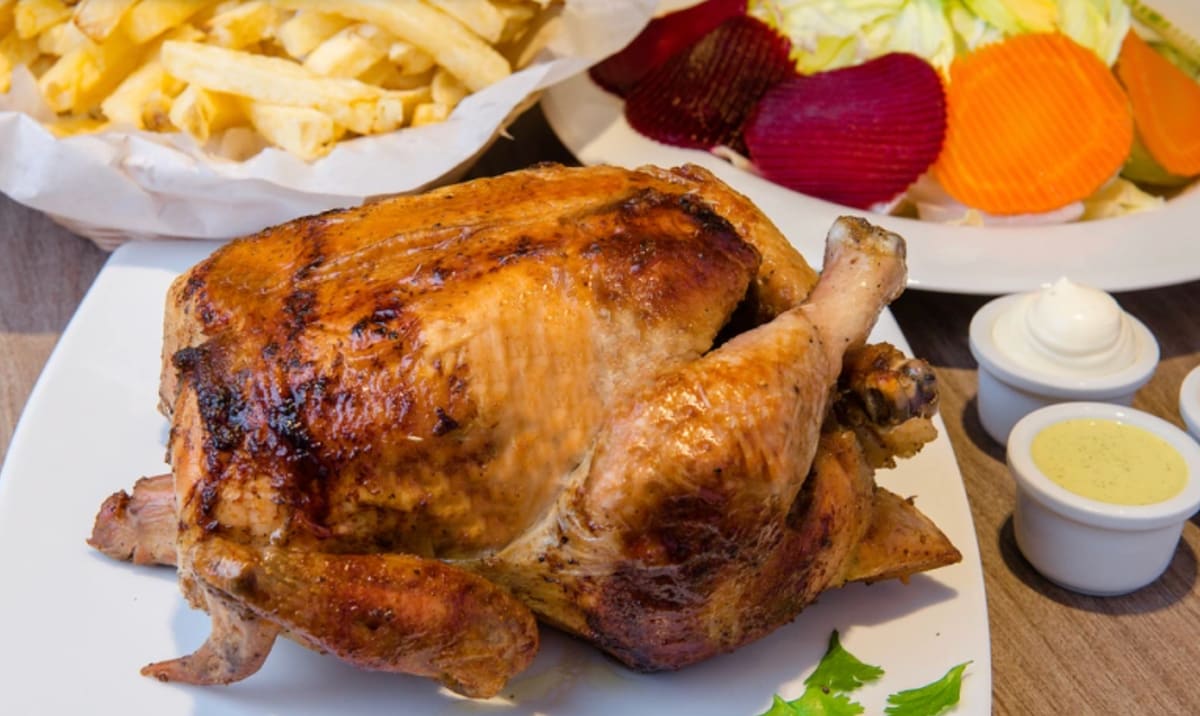 Pollo a la brasa roasted chicken with fries