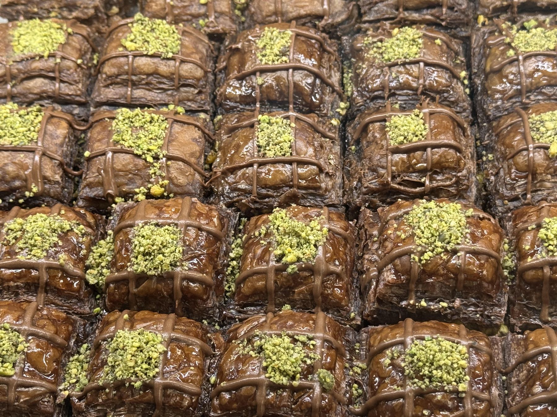 Tray of baklava pieces topped with pistachios in Mostar