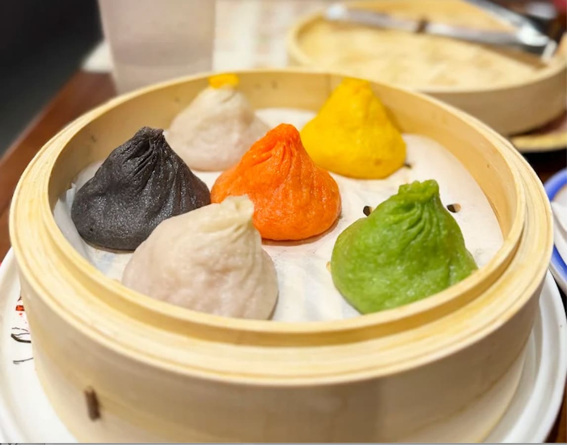 Dim sum spread with dumplings and buns in New York Chinatown