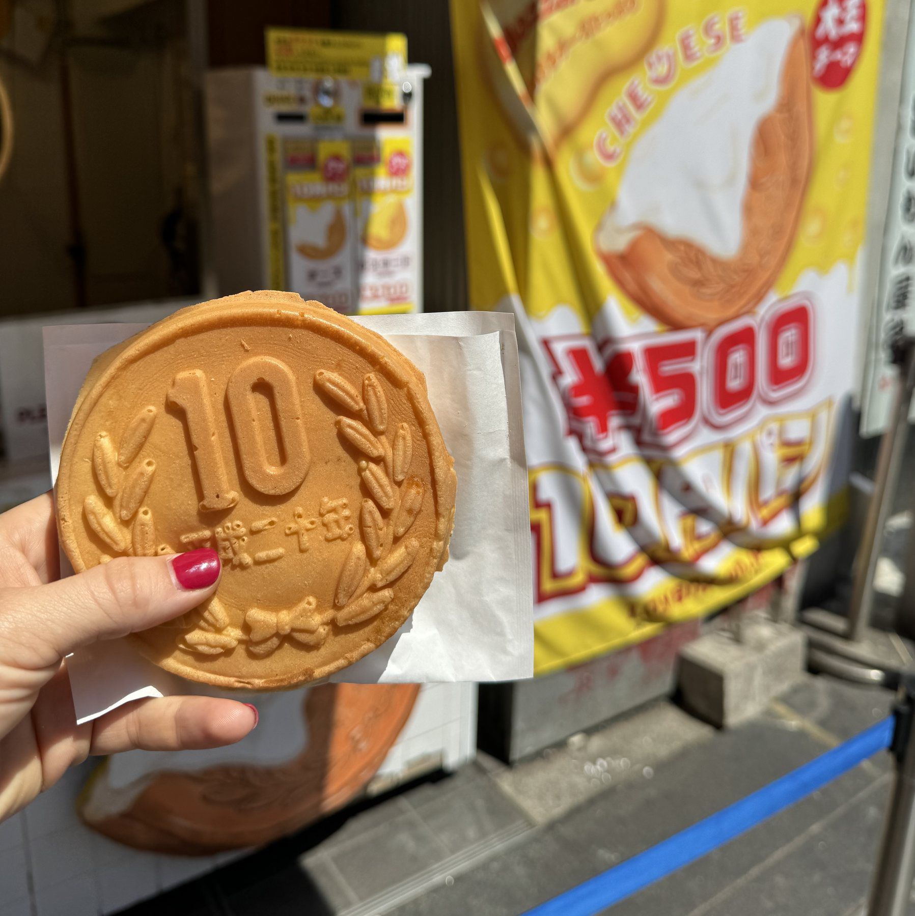 Cheese coin bread shaped like a large coin
