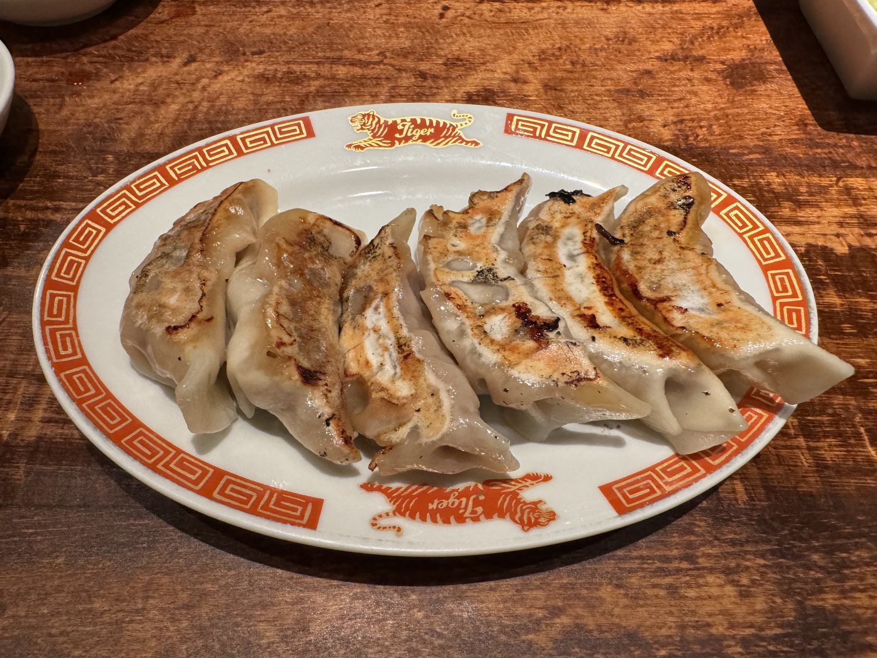 Japanese gyoza dumplings browned in a pan