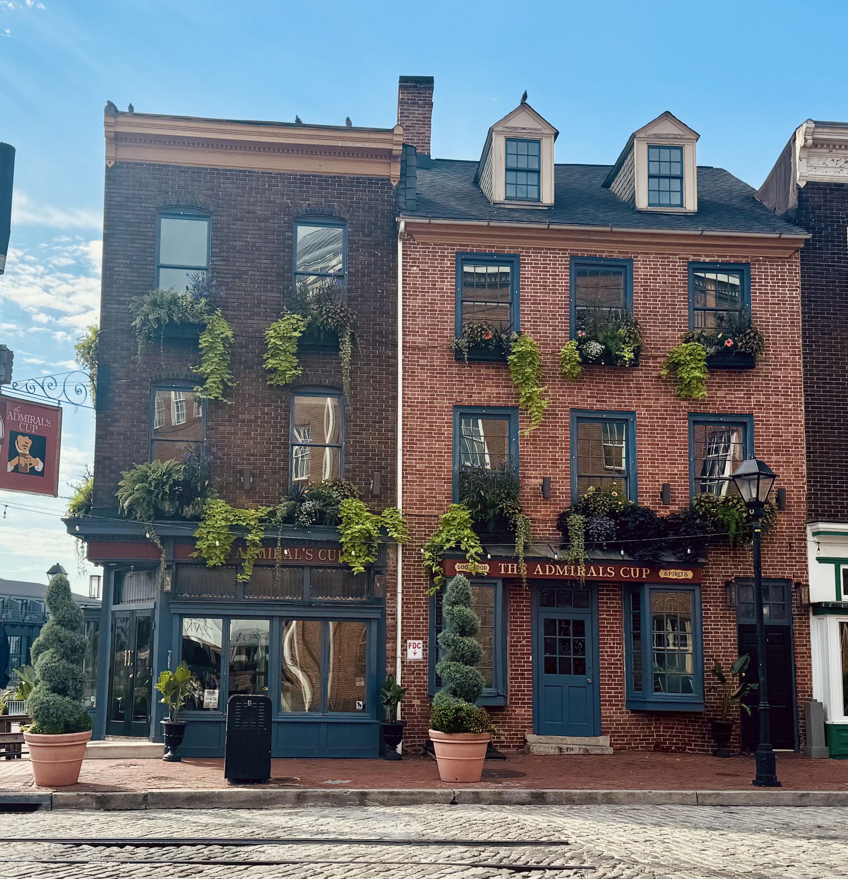 Historic brick buildings on a cobblestone street in Baltimore